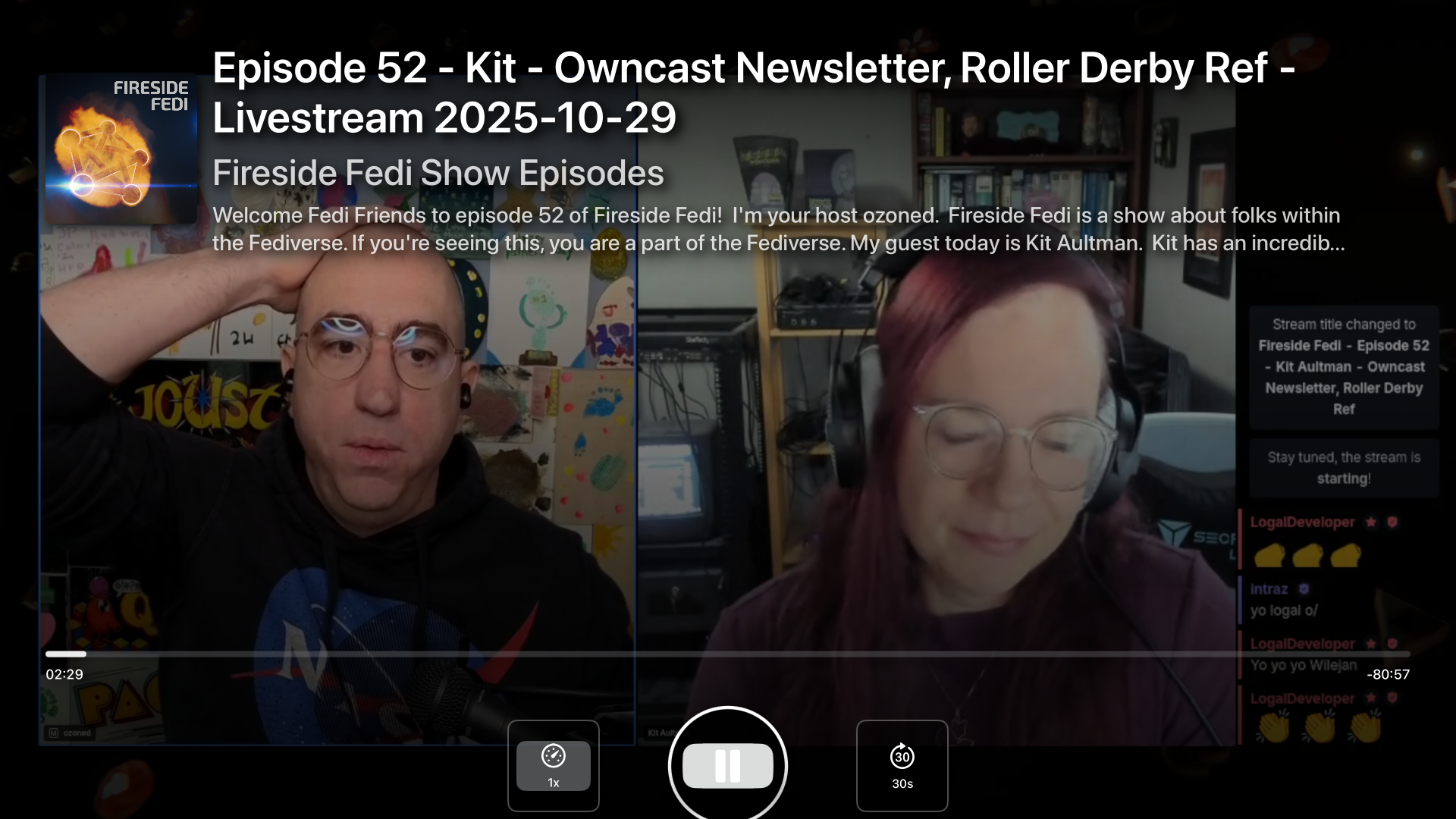 A screenshot of the Fireside Fedi show. Text reads "Episode 52 - Kit - Owncast Newsletter, Roller Derby Ref- Livestream 2025 - 10 - 29 Fireside Fedi Show Episodes. Welcome Fedi Friends to episode 52 of Fireside Fedi! I'm your host ozoned...My guest today is Kit Aultman. Kit has an incredib..." The video shows two people: Male presenting on the left, female presenting on the right. There are chat messages on the far right.